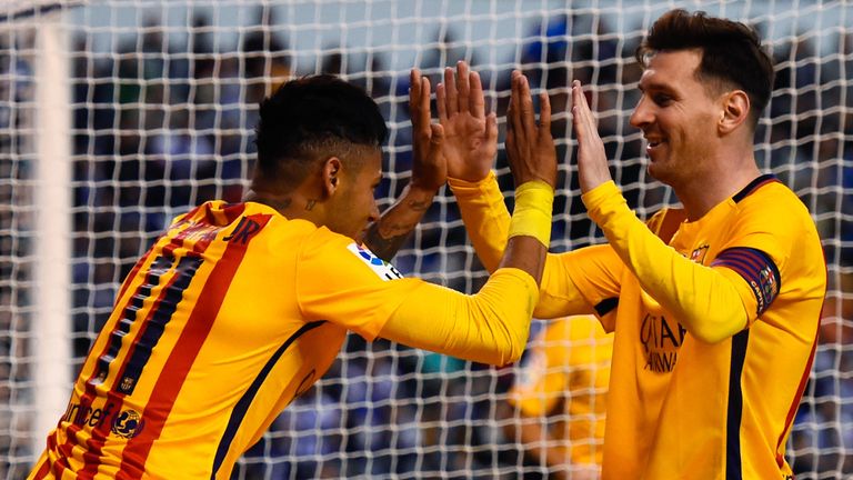 Neymar celebrates with team-mate Lionel Messi