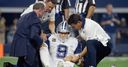 Romo breaks bone in back