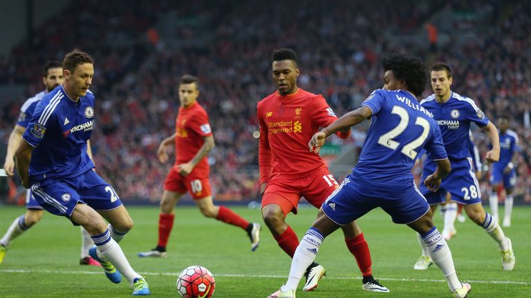 Daniel Sturridge looks to slip the ball past Willian and Nemanja Matic