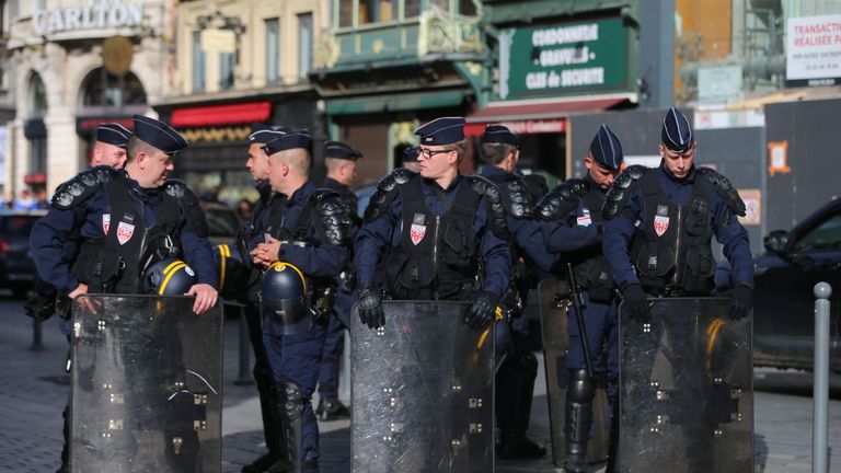 Riot police outside the train station in Lille city centre