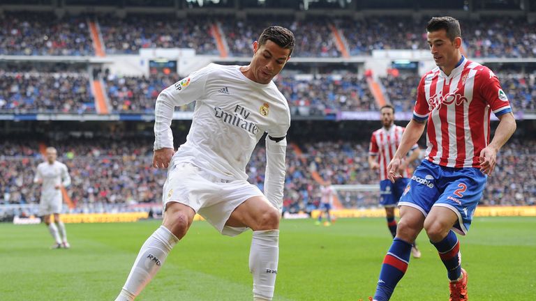 Hernandez playing for Gijon against Cristiano Ronaldo in La Liga