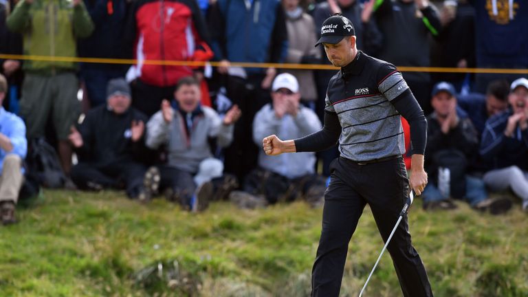 Henrik Stenson celebrates a birdie at the 14th to spark a run of four over the last five holes