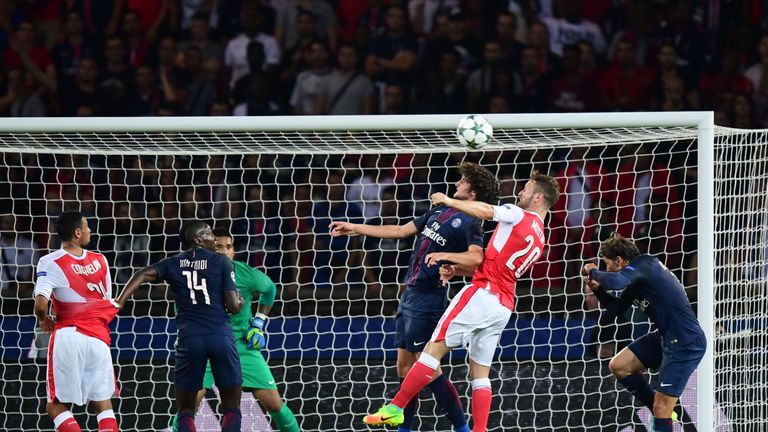 Adrien Rabiot  (third right) vies with Shkodran Mustafi (second right)