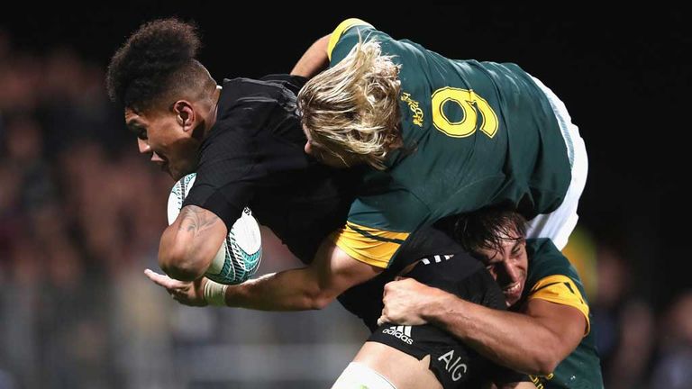 Ardie Savea carries Faf de Klerk on his back on his way to scoring a try