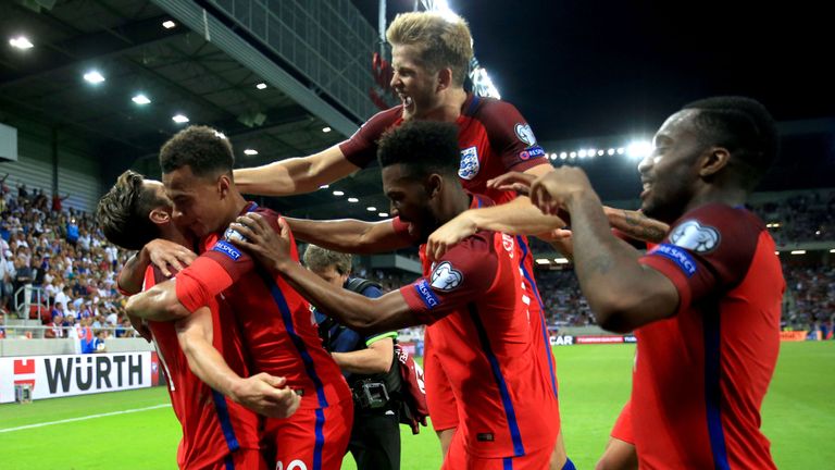 England's Adam Lallana (left) celebrates scoring his side's first goal