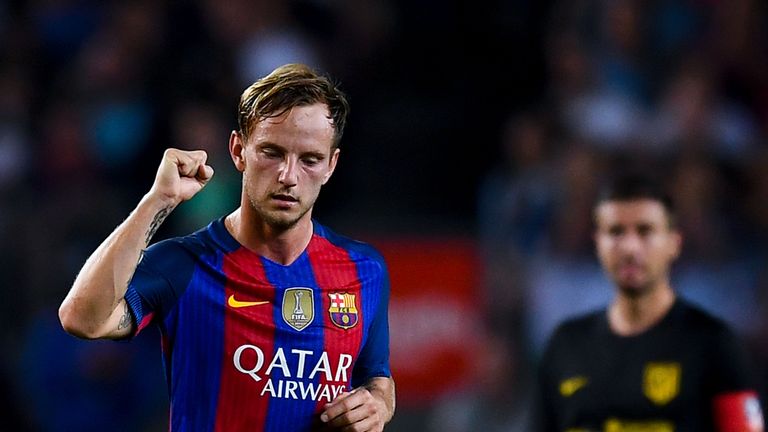 Ivan Rakitic celebrates the opening goal against Atletico Madrid