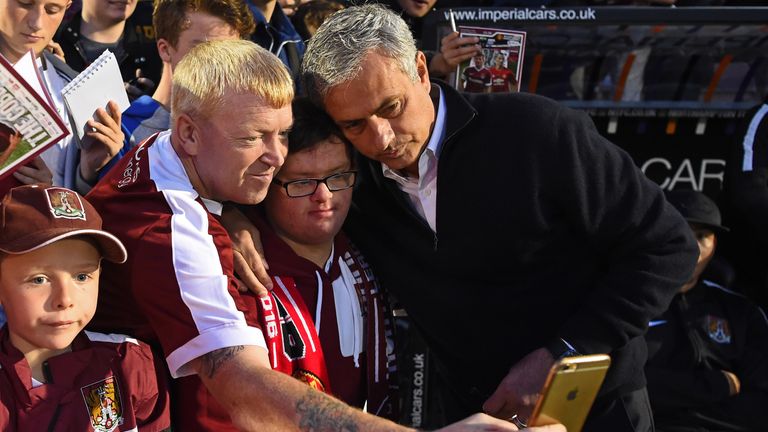 Manchester United manager Jose Mourinho pictured with the Northampton Town fans before kick-off