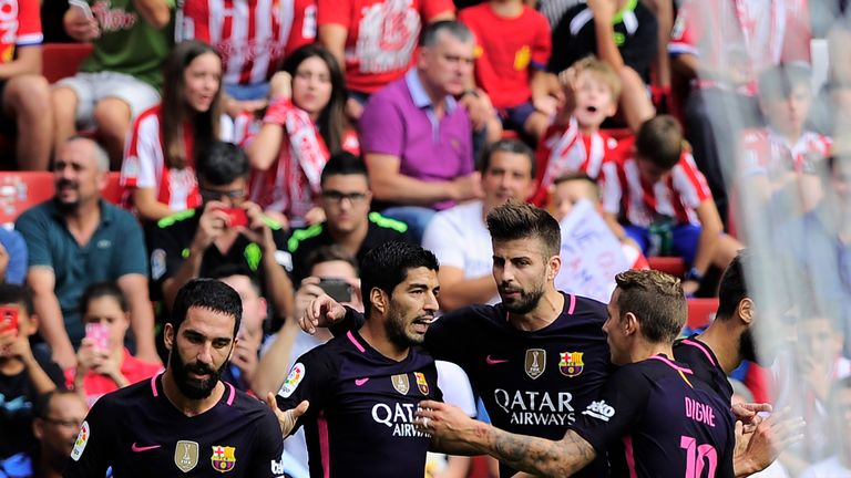 Luis Suarez is congratulated after scoring the opener for Barcelona