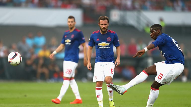 Pogba (right) tries his luck with a 30-yard free-kick