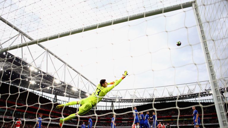 Thibaut Courtois dives to make a save