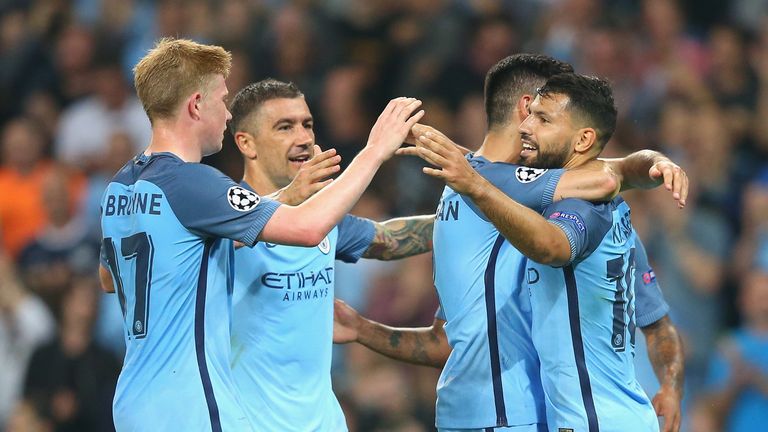 Aguero celebrates with team-mates 