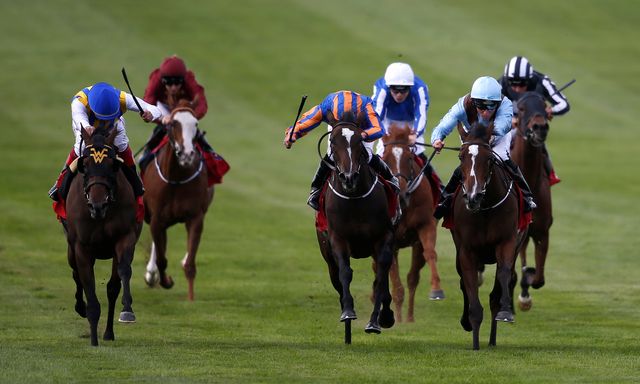 Seamie Heffernan and Brave Anna get the better of a battle with Roly Poly to win the Cheveley Park Stakes, with Lady Aurelia (far left) fading into third.