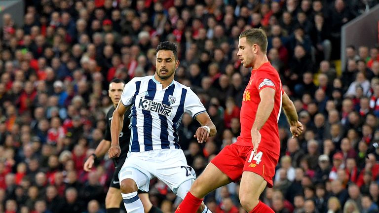 Jordan Henderson (right) challenges for the ball with West Brom midfielder Nacer Chadli 