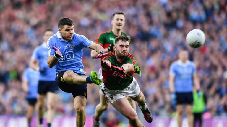 Dublin's Kevin McManamon and Mayo's Aidan O'Shea fight for the ball in the All-Ireland final replay at Croke Park