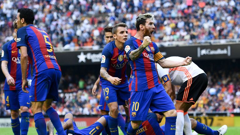 Lionel Messi celebrates after scoring from the spot