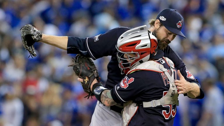 Andrew Miller #24 and team-mate Robert Perez #55 embrace after historic win over Toronto Blue Jays
