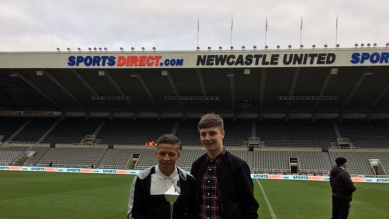 Newcastle striker Dwight Gayle is presented with October's Championship award by Michael Cantwell