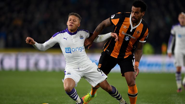 Newcastle's Dwight Gayle is challenged by Hull's Tom Huddlestone