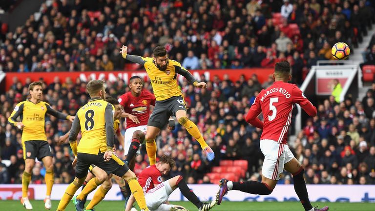 Olivier Giroud heads home a late equaliser for Arsenal