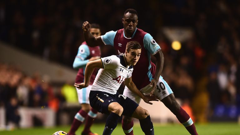 Winks of Tottenham (L) is put under pressure from West Ham's Antonio 