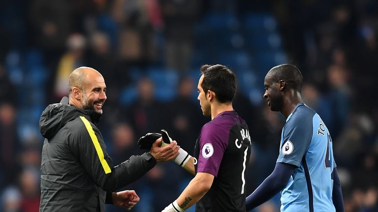 Pep Guardiola celebrates with Claudio Bravo and Yaya Toure after Manchester City beat Arsenal in the Premier League