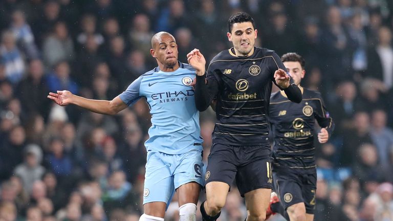 Manchester City's Fernando and Celtic's Tom Rogic battle for the ball 