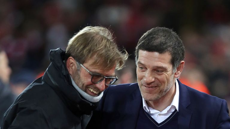 Liverpool boss Jurgen Klopp jokes with his West Ham counterpart Slaven Bilic
