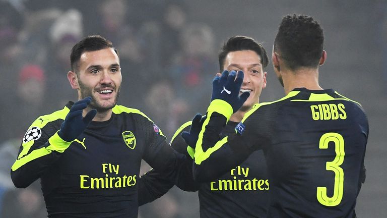 Arsenal forward Lucas Perez (L) scored a hat-trick for Arsenal