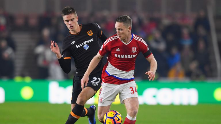 Adam Forshaw is chased by Markus Henriksen at the Riverside Stadium