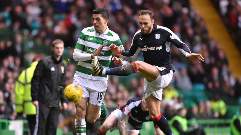 Tom Rogic (left) who later went off, is challenged by Tom Hateley