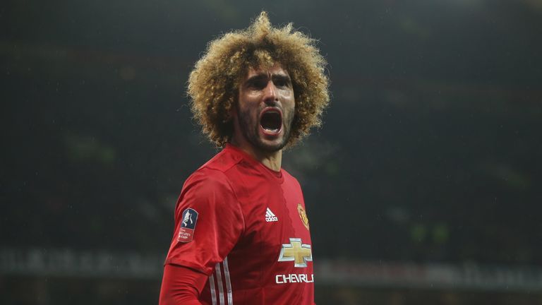 Marouane Fellaini celebrates Manchester United's opening goal against Wigan