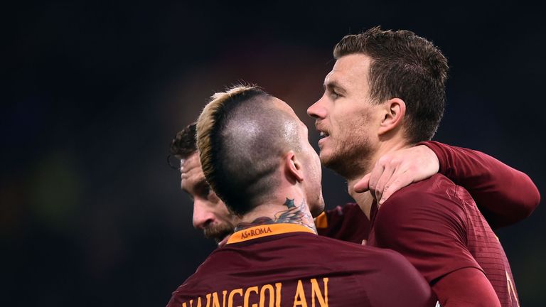 Roma's forward Edin Dzeko (right) is congratulated after scoring against Chievo