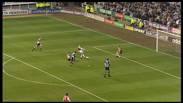 Bergkamp slots the ball past Newcastle 'keeper Shay Given
