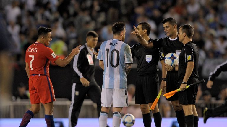 Messi speaks with the officials after the game against Chile