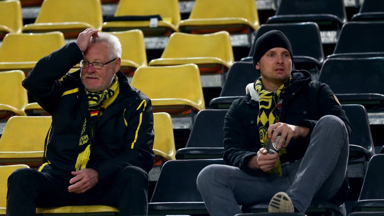 Dortmund fans show their concern as news reaches them of the explosions