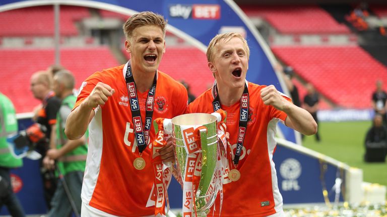 Blackpool goalscorers Brad Potts and Mark Cullen celebrate with the League Two play-off final trophy