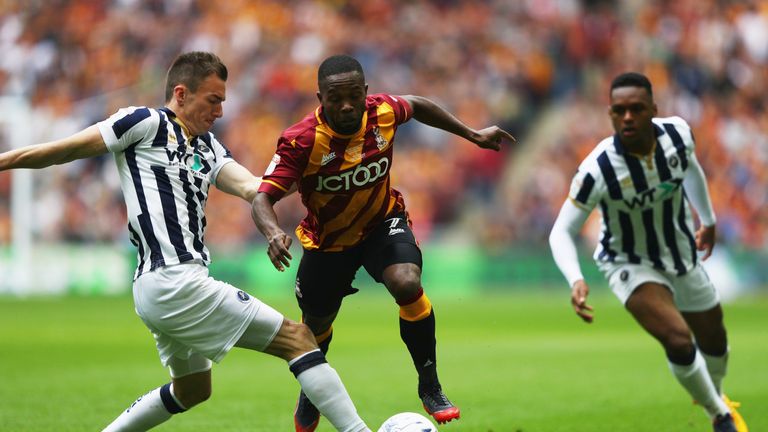 Bradford's Mark Marshall takes on Jed Wallace of Millwall