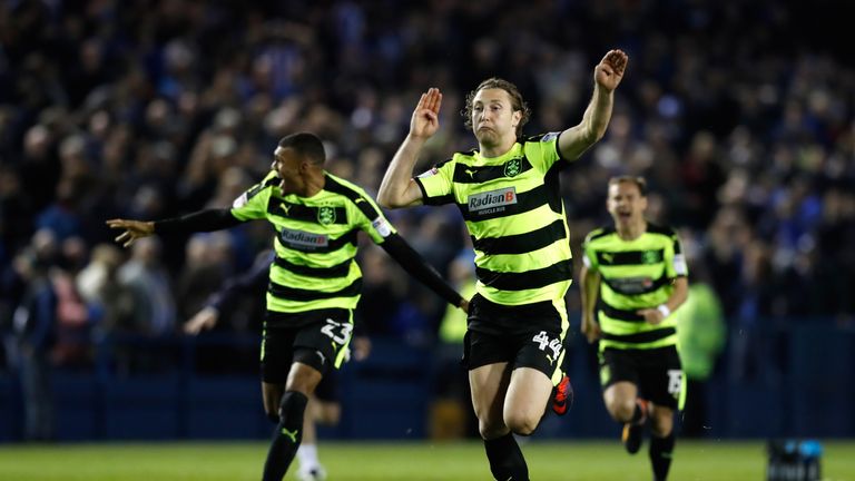 Hefele leads the Huddersfield celebrations after they won on penalties