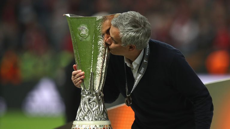 Jose Mourinho kisses the Europa League trophy