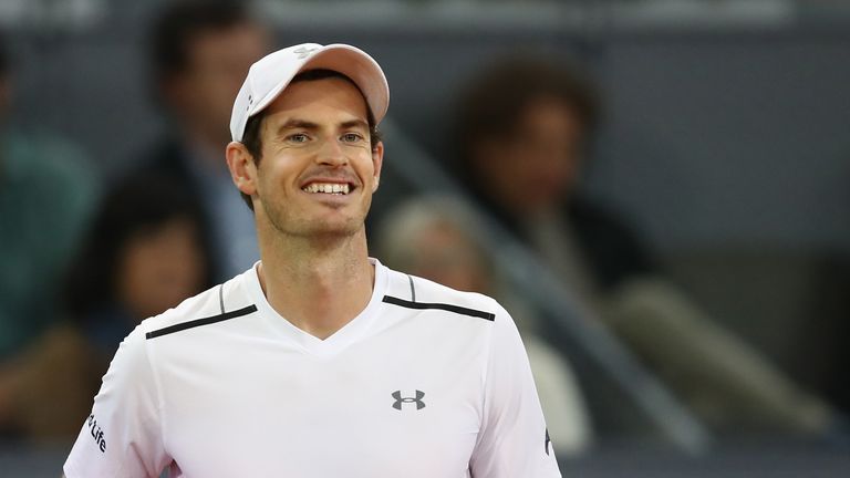 Andy Murray smiles towards his box during his surprise defeat to Borna Coric