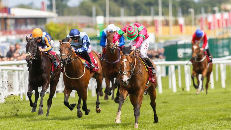 Visionary ridden by Jamie Spencer (right) wins the Shalaa Carnarvon Stakes