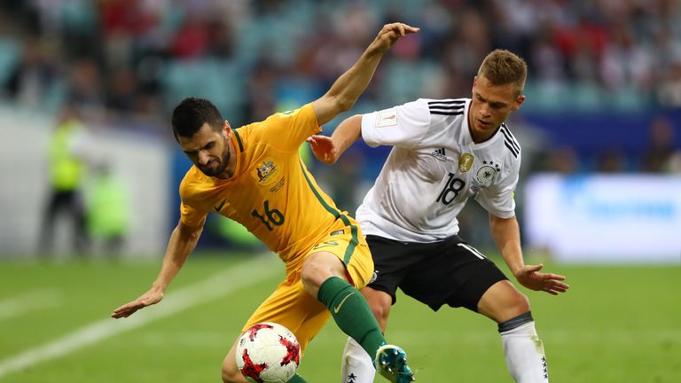Australia's Aziz Behich and Joshua Kimmich of Germany battle for possession