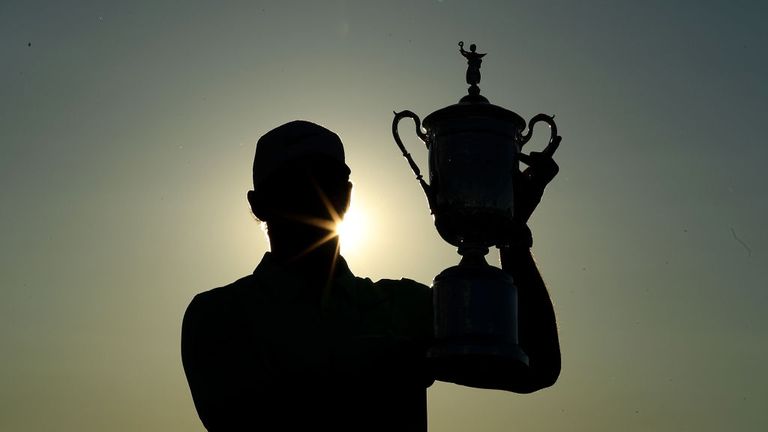 Brooks Koepka holds the US Open trophy
