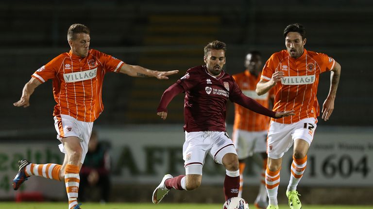 Conner Oliver (right) in action for Blackpool against Northampton during the Capital One Cup