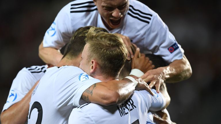 Mitchell Weiser is congratulated after his strike in the European U21 Championship final