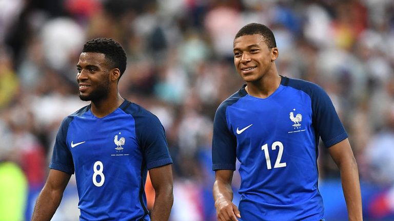 France's forward Thomas Lemar (left) and Mbappe react following their 3-2 win over England