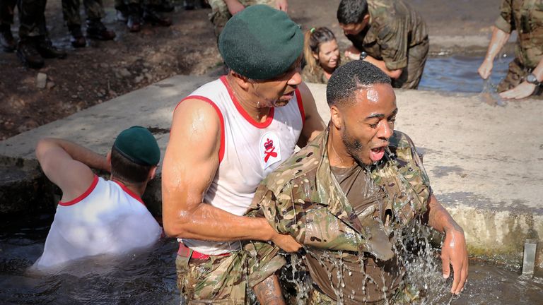 Raheem Sterling takes part in some unique team building as the England squad visit the Royal Marines (LPhot Barry Wheeler, Royal Navy)