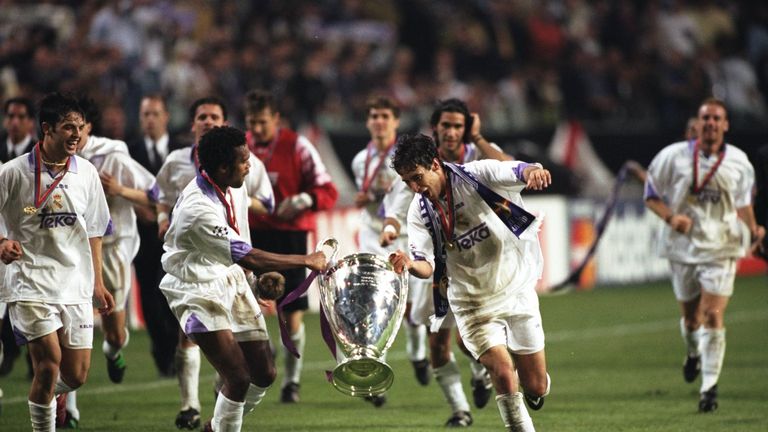 Real Madrid duo Christian Karembeu (left) and Raul celebrate with the trophy after beating Juventus in the 1998 Champions League final Amsterdam ArenA