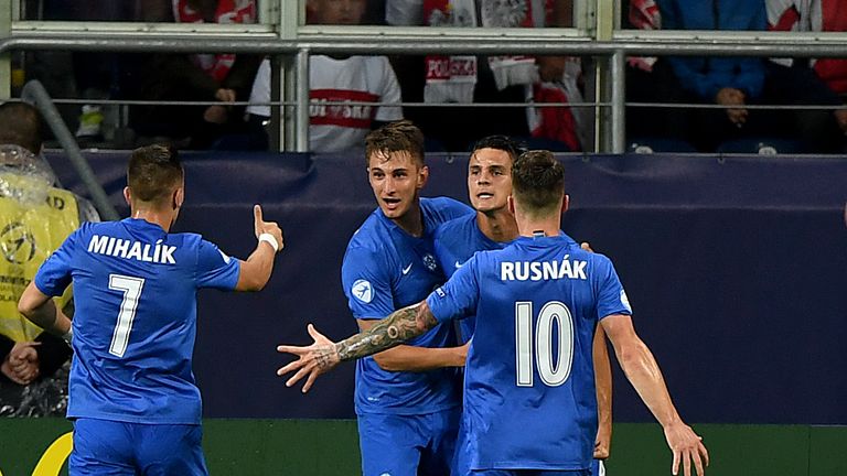 Slovakia's players celebrate scoring against Poland