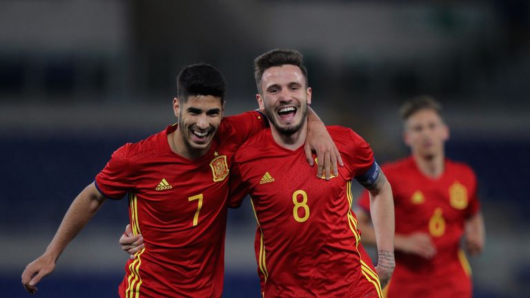 Real's Marco Asensio (L) and Atletico's Saul Niguez (R) play for Spain's U21s